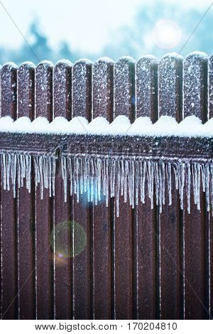 Цinter Icicles on fence after freezing rain