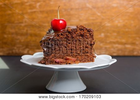 Chocolate cake with juicy cherries