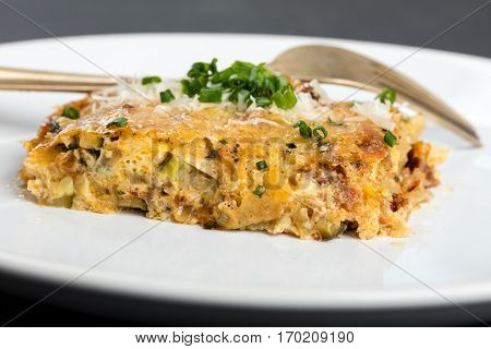 Vegetables casserole with cheese and chives