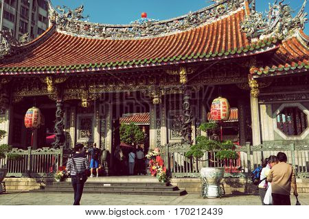 Taipei - December 2016: People in front of Lungshan Temple.
