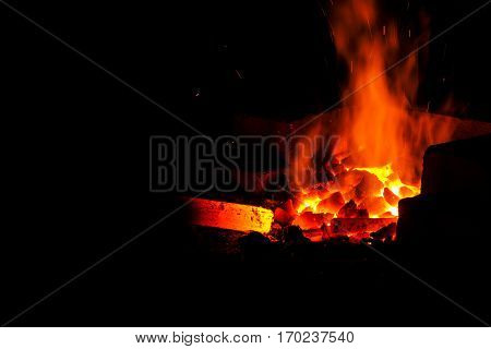 Blacksmith forged iron traditional hammer beating. Stoke