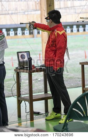 Rio Brazil - august 10 2016: PANG Wei (CHN) during shooting 50m Pistol Men Shooting at Olympic Games 2016 in Olympic Shooting Centre Deodoro