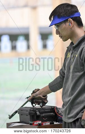 Rio Brazil - august 10 2016: SHI Jay (USA) during shooting 50m Pistol Men Shooting at Olympic Games 2016 in Olympic Shooting Centre Deodoro