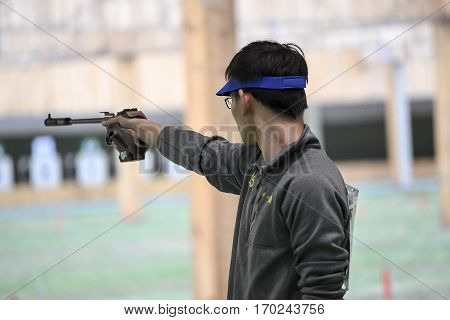 Rio Brazil - august 10 2016: SHI Jay (USA) during shooting 50m Pistol Men Shooting at Olympic Games 2016 in Olympic Shooting Centre Deodoro