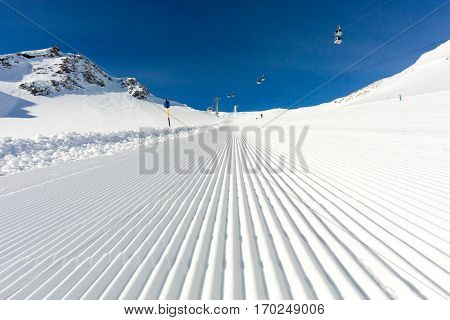Beautifully groomed ski on the Tiefenbach glacier at the popular ski resort Soelden in Austria.