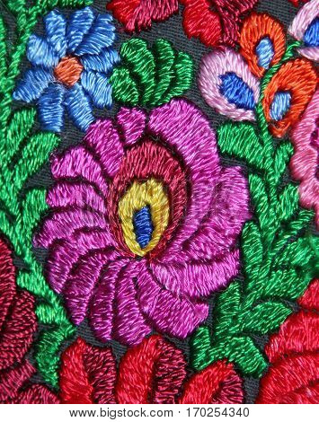 Multicolor floral hand embroidery pattern macro image