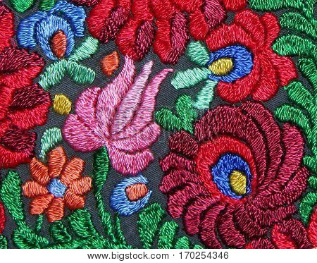 Multicolor floral hand embroidery pattern macro image