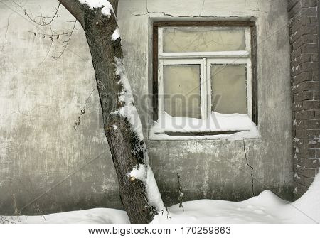 old window. winter landscape. Facades village of houses in the old style. Old vintage window of Russian house