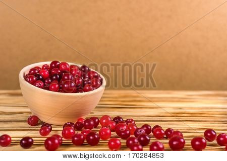Cranberry. Cranberries On Glay Plate Wooden Background