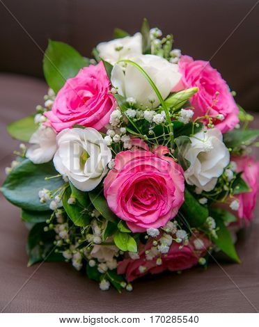 Beautiful wedding bouquet of red white flowers for the bride on the wedding day