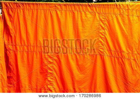 yellow monk cloth wash and dry on clothes line