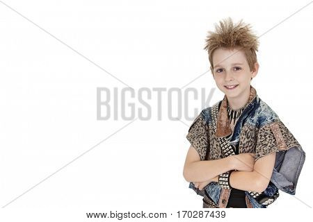 Portrait of pre-teen boy standing with arms crossed over white background