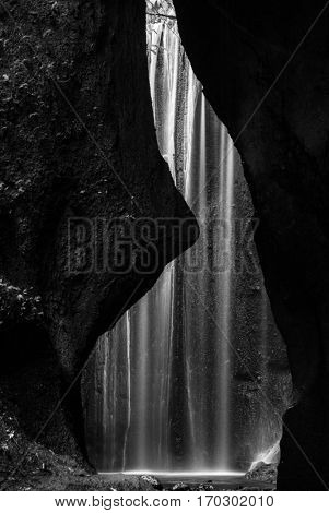Beautiful Tukad Cepung Waterfall in Bali, Indonesia. Black and white shot