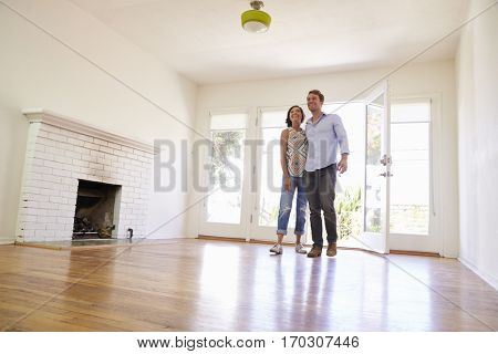 Excited Couple Explore New Home On Moving Day