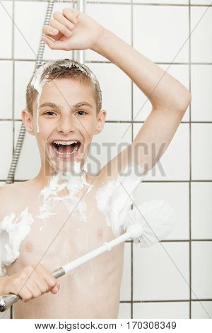 Young Boy Laughing As He Lathers Himself