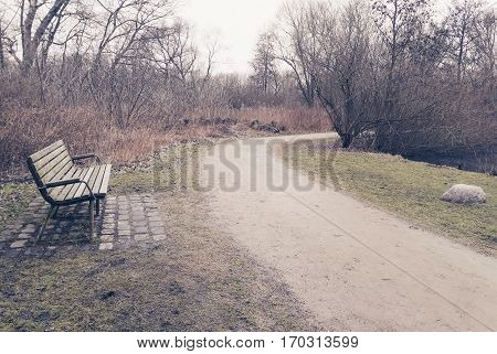 Lonely old wooden bench outdoor in Brunevang Rodovre Denmark