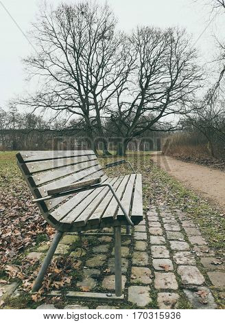 Lonely old wooden bench outdoor in Brunevang Rodovre Denmark