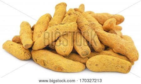 Close up of Dry turmeric over white background
