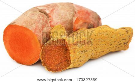 Close up of Pieces of turmeric over white background
