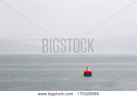 A buoy in bosphorus in a rainy day