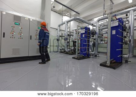 ST. PETERSBURG, RUSSIA - DECEMBER 16, 2016: Operator in one of the central heating points. There is 219 central heating points in the city, 60 of which is automated