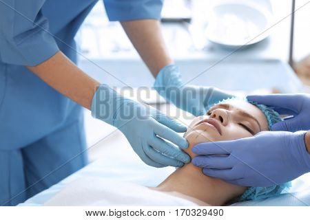 Young woman at cosmetology clinic