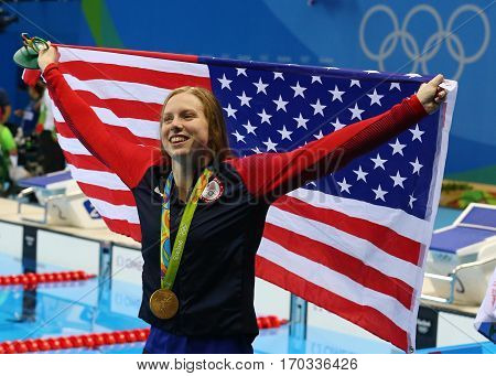 RIO DE JANEIRO, BRAZIL - AUGUST 8, 2016: Olympic Champion swimmer Lilly King of the United States celebrates victory after Women's 100m Breaststroke Final of the Rio 2016 Olympic Games