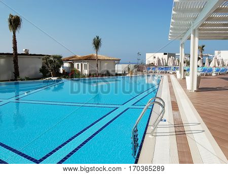 Alanya, Turkey - June 5, 2015: Blue pool, white tent in a Turkish hotel Sirius Deluxe.