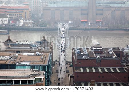 LONDON, ENGLAND - JANUARY 23, 2017: Tate Modern and Millennium Bridge covered in thick fog. Aerial view from St Paul's, London.