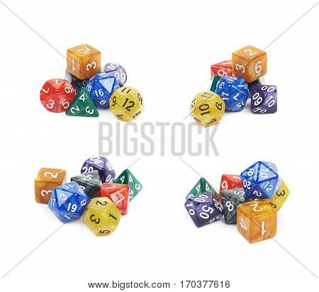 Pile of colorful roleplaying polyhedral dices isolated over the white background, set of four different foreshortenings