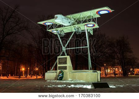 Gatchina Russia - February 10 2016: Monument in honor of the 100th anniversary of the first military airport in Russia. Airplane Model Foreman. Night Photography.