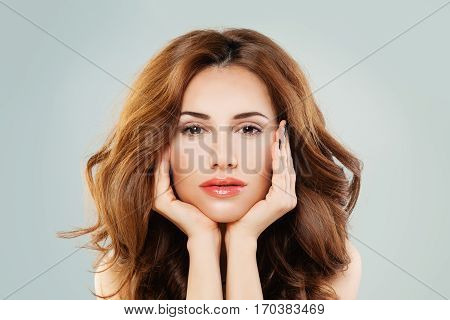 Beautiful Female Face. Healthy Woman with Perfect Skin and Hairstyle