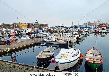 Torshavn, Faroe Islands - June 05, 2014: Trawler and pleasure boats in the port of Torshavn in the Faroe Islands.