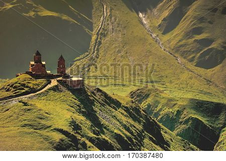 Holy Trinity Church near Mount Kazbek in Georgia. Tsminda Sameba. Mediaeval Church in mountains