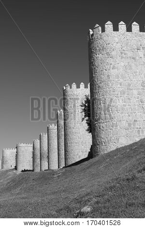 Avila (Castilla y Leon Spain): the famous medieval walls surrounding the city. Black and white