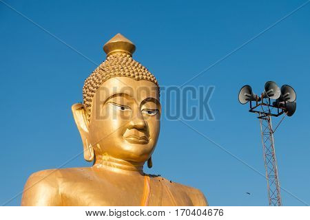Close-upThe huge golden Buddha at khao kiaw temple in ratchaburi Thailand.