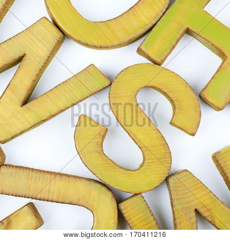 Surface coated with the multiple painted wooden block letters as an abstract backrop composition