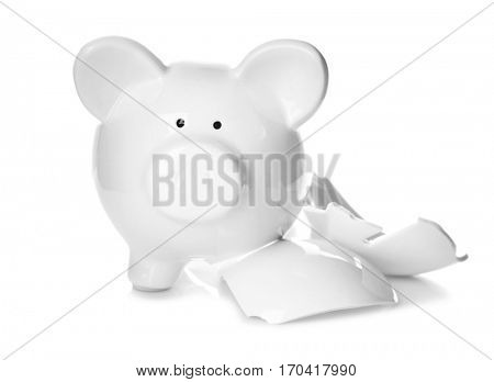 Broken piggy bank on white background