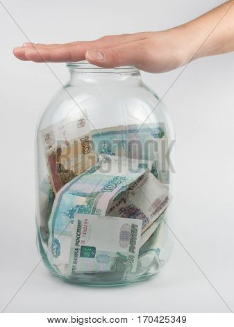 Hand Covered The Three-liter Jar With Russian Money