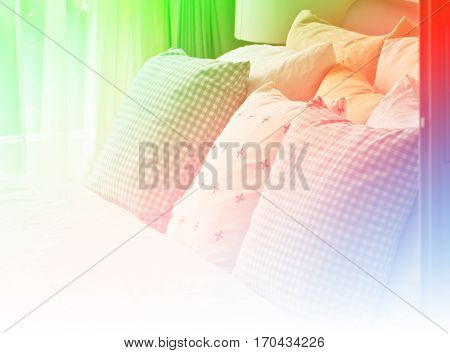 Comfortable soft pillows on the bed with color filter