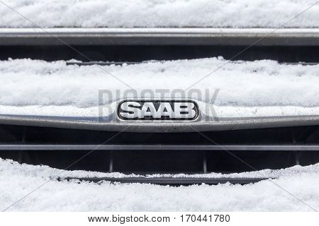 The Hague the Netherlands - February 11 2017: Saab emblem covered in snow emblem