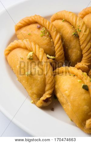 Gujiya - sweet dumplings made during the festival of holi and diwali, selective focus