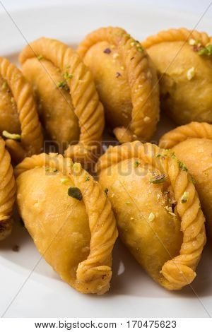 Gujiya - sweet dumplings made during the festival of holi and diwali, selective focus