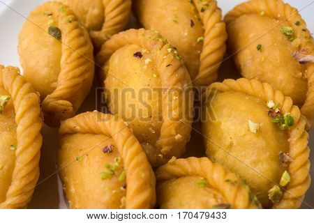 Gujiya - sweet dumplings made during the festival of holi and diwali, selective focus