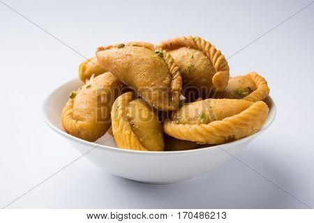 Gujiya - sweet dumplings made during the festival of holi and diwali, selective focus