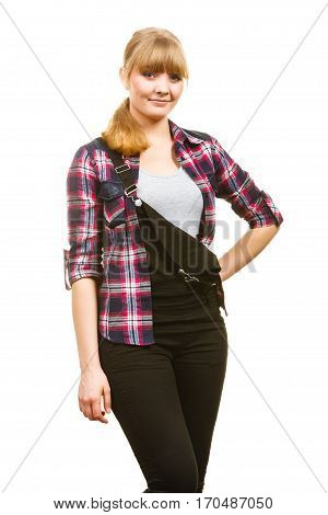 Gardening fahion concept. Smiling attractive woman in pink check shirt and dungarees. Isolated background