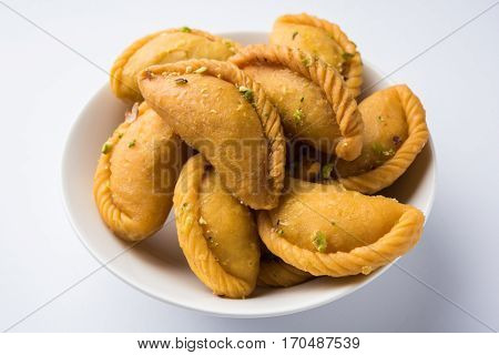 Gujiya - sweet dumplings made during the festival of holi and diwali, selective focus