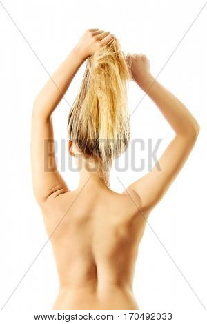 Photo of combing woman with long blond hair