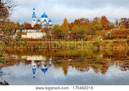 Beautiful romantic alley in a park with colorful trees and sunlight. autumn natural background. Gatchina