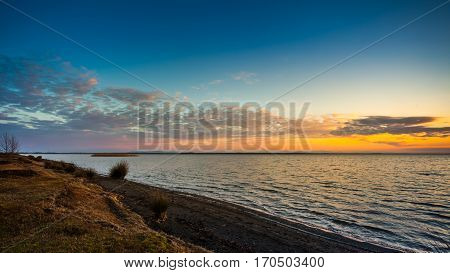 Colorful sky and water in lake Paliastomi in morning Poti Georgia.